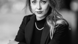 Solitary figure against Westminster's grandeur.